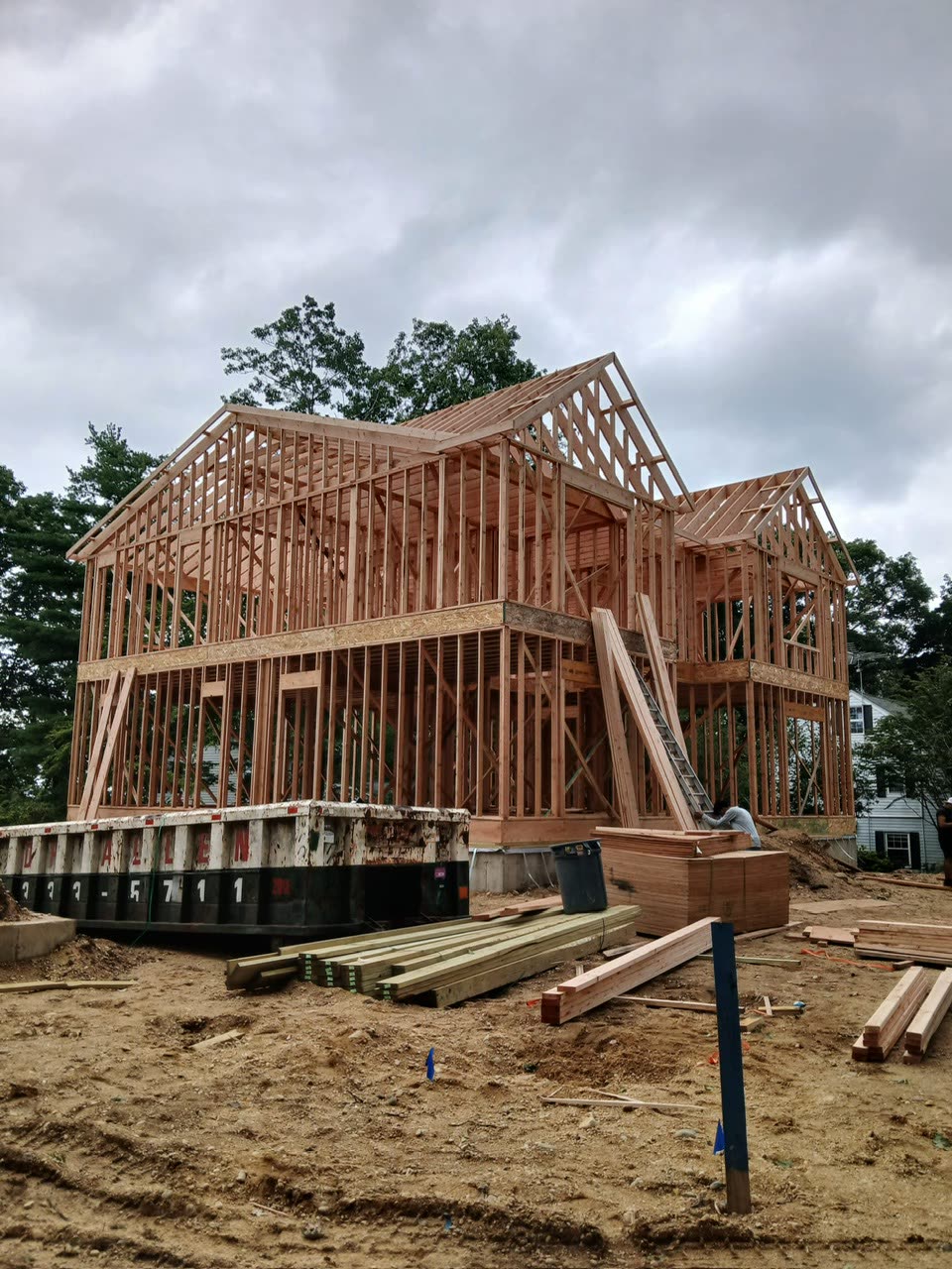 Two-storey house framed out, roof rafters and headers set