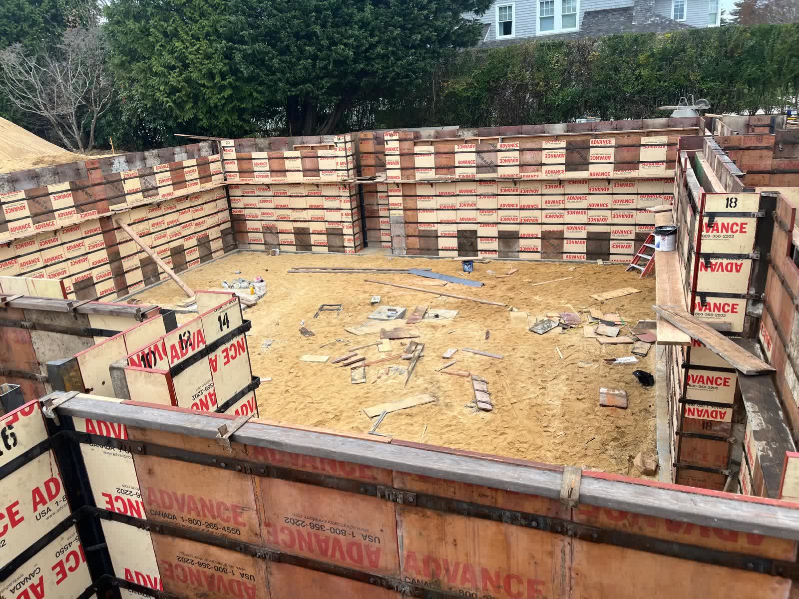 Foundation wall forms set and braced on a Hamptons build site
